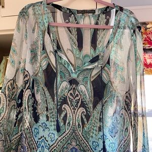 Beautiful, sheer blouse. Perfect for Spring!